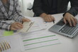 © MrAshi - Two businessmen meeting to analyze financial reports with tablet on paper on table and analyze the power dashboard display. on your tablet screen for business insights