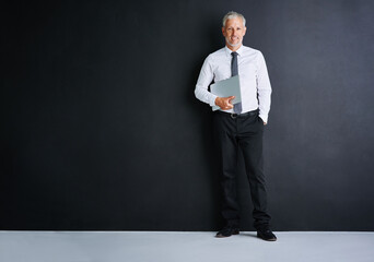 Poster - Business man, laptop and studio for smile by space, portrait and mock up by black background. Mature person, executive or actuary with computer for risk assessment at insurance agency in Australia