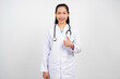 © panadesignteam - Female doctor giving thumbs up isolated background