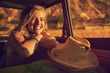 Girl, portrait and road trip for vacation in car, sunrise and weekend trip to Nevada for adventure. Female person, relax and vehicle for journey to nature, holiday and happiness for getaway drive