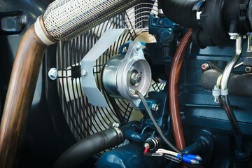 Aufkleber - A close up of a car engine with a lot of wires and a lot of bolts. The engine is black and white
