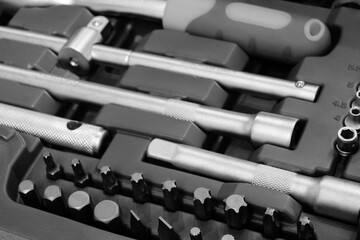 Poster - A toolbox with many different tools including a wrench. The wrench is silver and has a black handle