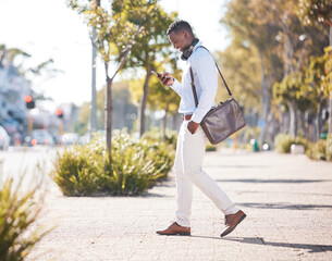 Canvas Print - Outdoor, business and black man with smartphone, typing and walking in city, texting and social media. African person, employee and consultant with cellphone, message and online reading with smile