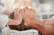 © Van Wyk/peopleimages.com - Client, head massage and hands of person for healing, treatment or stress relief at spa. Resort, relax and masseuse with mature customer for wellness therapy, luxury vacation or peaceful on bed