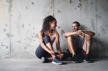 Canvas Print - Couple, shoes and tie lace outdoor for fitness, wellness and accountability as relationship goals. Man, woman and workout start by bridge with teamwork, training and cardio together for libido health