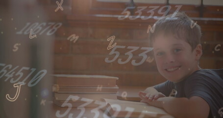 Poster - Image of multiple alphabets and numbers floating over caucasian boy smiling in class at school