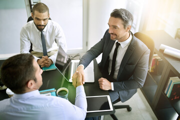Aufkleber - The beginning of a profitable partnership. Shot of colleagues shaking hands during a formal meeting in an office.