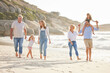 © MagicDavid/peopleimages.com - Beach, walking and kids with parents and grandparents on summer vacation, adventure or holiday. Holding hands, love and family with generations by ocean for tropical weekend trip in Australia.