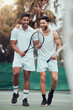 © peopleimages.com - Friends, tennis and men with joke, laughing and happy for match with goals, court and fitness for sports. Outdoor, teamwork and game for people, healthy and competition for performance in club