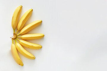 Wall Mural - Fresh yellow banana on a white background. Exotic fruit concept. Copy space