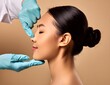 © LL - Surgeon touching woman nose, consulting before rhinoplasty operation on beige background