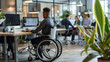 © Jirawatfoto - Inclusive Workplace - Wheelchair User Engaged in Office Collaboration with Colleagues