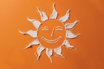 Wall Mural - sun symbol on orange background drawn with white sun cream