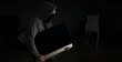 © H_Ko - Thief in balaclava carries PC from apartment of victims background. Installation security systems for houses concept