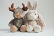 © JIALU - Cute stuffed moose and bunny plush toys sitting together on a white background, soft lighting, wide angle shot, studio photography style, perfect for stock photo concept art.
