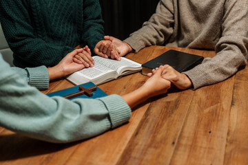 A person reads the Bible, embodying faith and spirituality. The scene reflects a serene moment of contemplation and devotion, highlighting the importance of religion in everyday life.