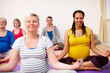 © Leffy/peopleimages.com - Pregnant, smile and meditation class with woman, calm and pregnancy pilates. Yoga, zen or group of female people mother or maternity, workout or health or support together for spiritual practice