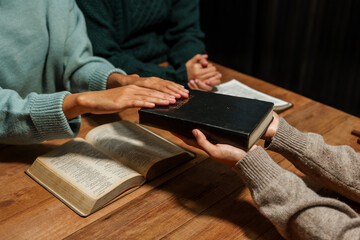 Wall Mural - A person reads the Bible, embodying faith and spirituality. The scene reflects a serene moment of contemplation and devotion, highlighting the importance of religion in everyday life.