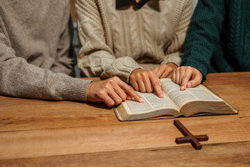 Wall Mural - A person reads the Bible, embodying faith and spirituality. The scene reflects a serene moment of contemplation and devotion, highlighting the importance of religion in everyday life.