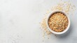 © AkuAku - Oats in white bowl on plain background with space for text