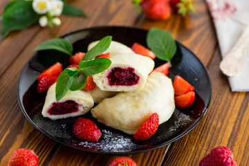 Wall Mural - cooked sweet homemade steamed dumplings with strawberries