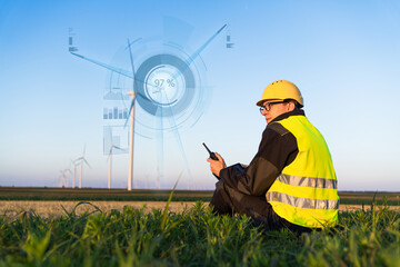 Aufkleber - Engineer with digital tablet controls wind turbines