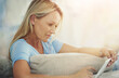 © Y.A./peopleimages.com - Mature, woman and tablet with relax on sofa for internet browsing, social media app or online subscription. Person, smile and digital technology on couch in living room for reading ebook or blog post