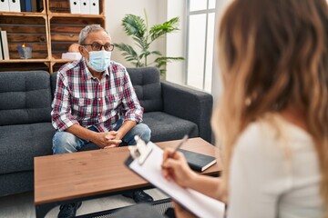 Sticker - Cheerful senior man radiates joy at psychology clinic, exhibiting a confident, toothy smile while wearing a medical mask