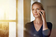 © Rosy/peopleimages.com - Window, woman and thinking in office in phone call for communication and networking in New York. Lens flare, business ideas and female employee as property developer or real estate with consultation