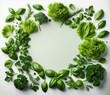 © Nattakarn - A variety of fresh green herbs and vegetables arranged in a circular frame on a white background..Concept: Healthy lifestyle, Fresh ingredients, Vegetarian food.