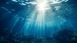 © venusvi - Ocean surface seen from underwater, deep blue tones and sun rays