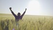 © procinemastock - Happy farmer on the field of young wheat on the background of the sunrise thank God for a good harvest - slow motion