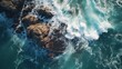© venusvi - Top-down view of waves smashing against coastal rocks, dramatic ocean scene