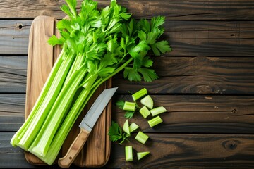 Sticker - Bunch of celery with knife on wooden board, ready for cooking