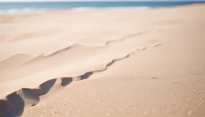 Close up sand with blurred sea sky background, summer day, copy space or for product. Summer background concept.