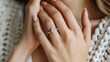 © Matcha_09 - Close-up of a woman's hand with a diamond ring on her ring finger, perfect for business-themed posters and banners