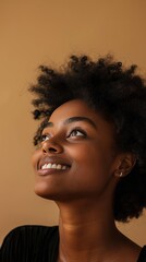 Wall Mural - Happy beautiful woman on beige studio background.