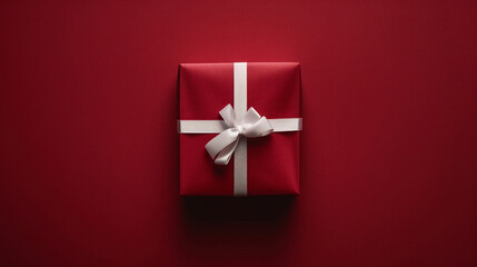 Wall Mural - red gift box with white ribbon isolated on red background