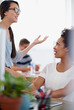 © peopleimages.com - Women, people and happy in office with conversation or discussion on work break as graphic designer. Business, employees and smile with chat for meeting, brainstorming and unity for project or task