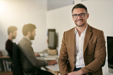 Poster - Creative, man and portrait with smile in office for work or career in project management by agency. Lead graphic designer, studio supervisor and professional in workplace, pride and proud for job.