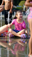 Joyful Sprinkler Splash. Splashing into Summer Fun.