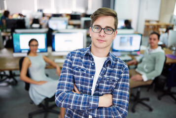 Poster - Portrait, arms crossed and creative man confident, employee or agency with glasses, coworking and business. Office, graphic designer and opportunity to learn for intern, proud and person in startup