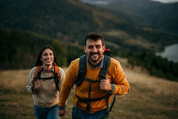 Wall Mural - Couple holding hands and trekking together with an amazing view in the background