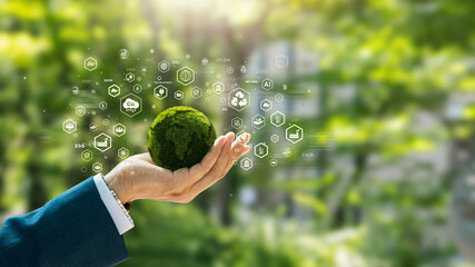 Wall Mural - Environmental concept. Green globe in the hands of a businessman with icons. Green future goals, ecology, esg, earth day, forest conservation, CSR, sdgs, Net Zero