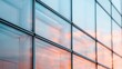 © svastix - A stunning glass wall reflects a vivid sunset, capturing an array of beautiful colors and geometric patterns, merging the essence of nature and human architecture.