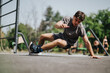 © qunica.com - Man working out at an outdoor gym, showcasing strength and agility in a fitness routine on a sunny day.