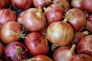 Sticker - Closeup of ripe red onions displayed for sale at a local farmer's market