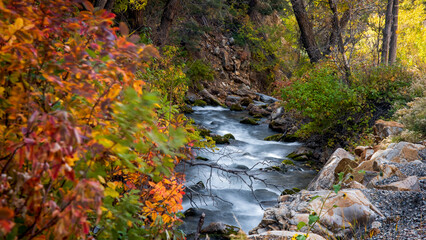 Sticker - Water falls on Big Cottonwood creek in Utah during autumn time, long exposure shot.