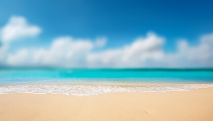 Wall Mural - abstract blur defocused background tropical summer beach with golden sand turquoise ocean and blue sky with white clouds on bright sunny day colorful landscape for summer holidays