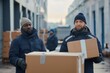 © Igor - Couriers in uniform preparing the shipment of boxes